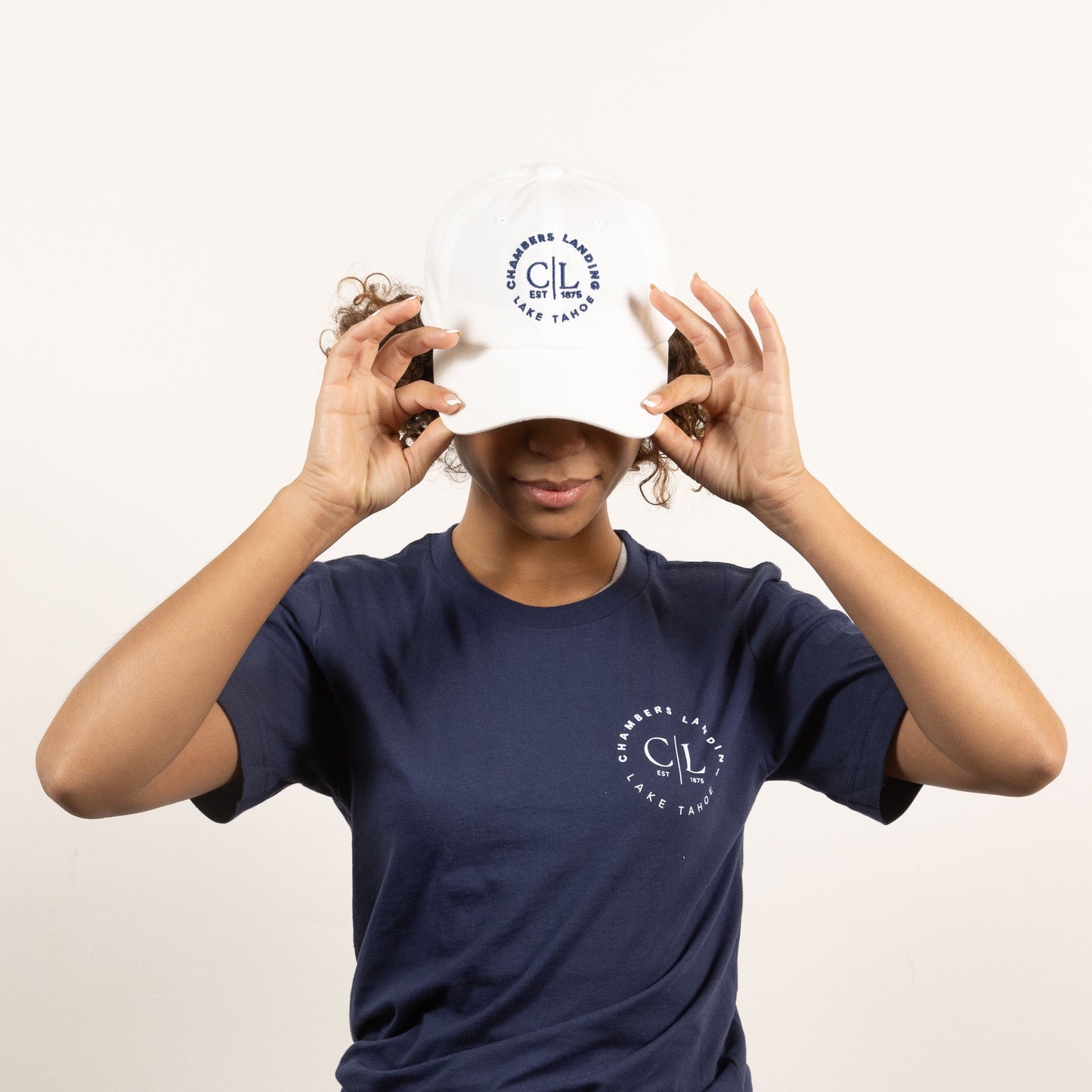Chambers Unisex White Baseball Cap With Navy Blue Logo